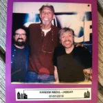 A picture of three men standing next to each other.