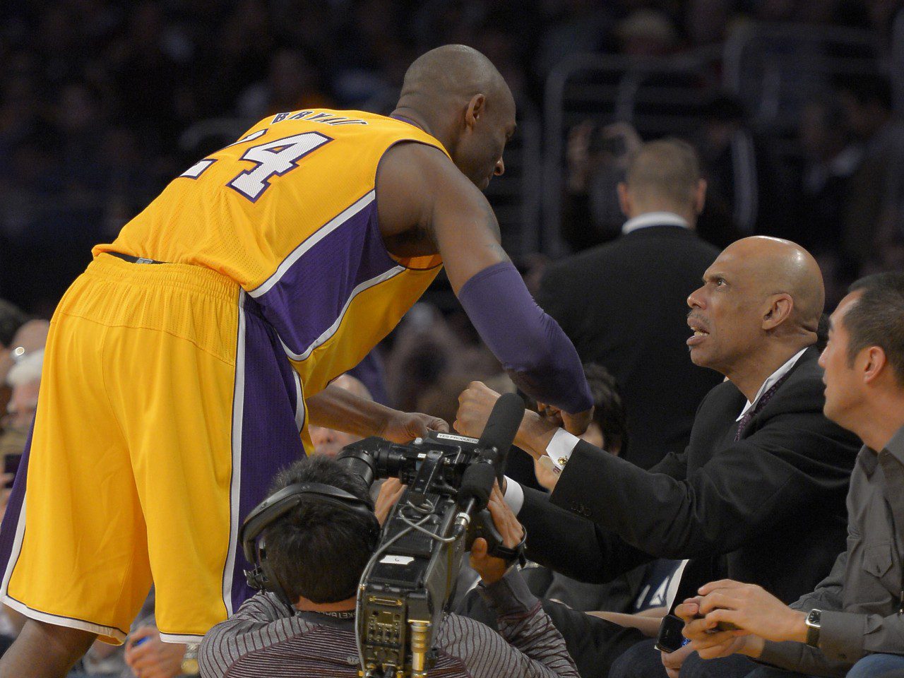 A basketball player is getting ready to shake hands with an official.