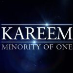A black and white logo of kareem, minority of one.