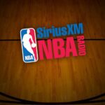 A wooden table with a logo of the nba and sirius xm radio.