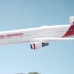 A large passenger jet flying through the sky.