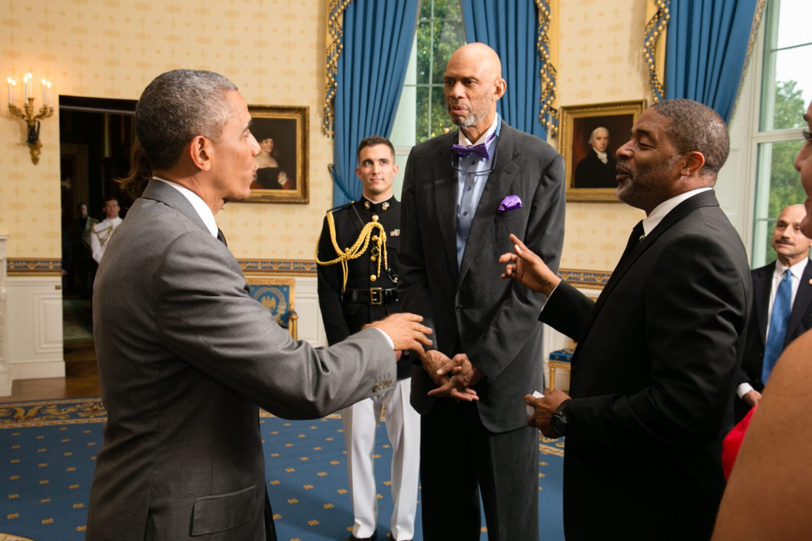 A group of men standing in front of each other.