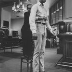 A man and woman standing in front of each other.